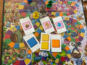 A top down view of the board, cards and the pieces