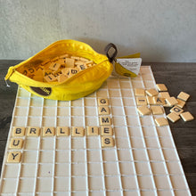 Load image into Gallery viewer, A picture of the tiles in the tray with the words &quot;buy braille games&quot; spelled out.
