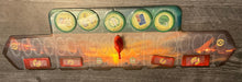 Load image into Gallery viewer, The military track with a transparent overlay on it that has circles for all of the spots on the board. Tokens are on the appropriate squares, all with transparent braille on them.
