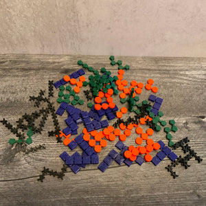 A picture of all the 3d printed pieces included in the accessibility kit. Each piece is has a shape associated with the color that is tactile.