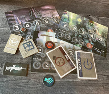 Load image into Gallery viewer, A bunch of the tokens and cards from the game laid out. all of the tokens and cards have transparent braille on them.
