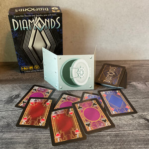 The diamond cards with transparent braille on them and the player shield