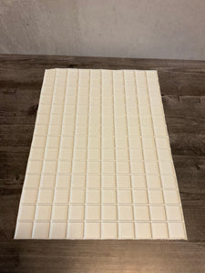 A solid white grid in styrene plastic with 10x14 inch squares
