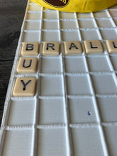 Load image into Gallery viewer, A close up on the tiles showing the word BUY
