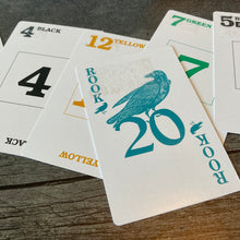 Load image into Gallery viewer, A close up on the rook card with transparent braille on it
