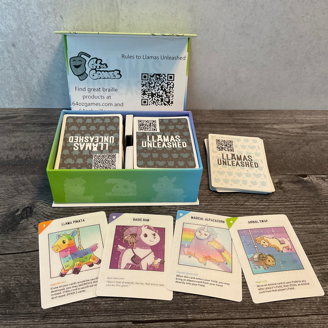 The llamas unleashed box open. A few of the cards with the transparent braille stickers are shown. The QR codes on the backs of the cards for the full text are also seen