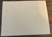 Load image into Gallery viewer, The alphabet in print on a piece of white plastic. It is extruded upward.

