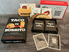 Load image into Gallery viewer, The box along with some of the cards laid out. Food is inside the taco folder and burrito folders. All the cards have transparent braille on them
