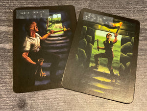 The camp and torch cards. They look pretty similar in print so a lot of players make a mistake and I've often heard it called the hardest part of the game but you won't because their names are in braille.