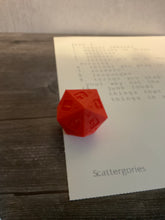 Load image into Gallery viewer, A close up shot of the 3d printed die and one of the lists.
