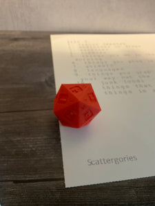 A close up shot of the 3d printed die and one of the lists.