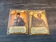 Load image into Gallery viewer, The guard and prince cards close up. Both have braille on them
