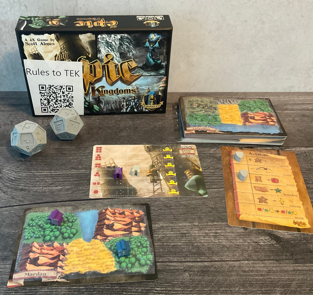 A shot of a Tiny Epic Kingdoms map, the tower card, and the action selection cards. The war dice can be seen