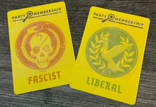 Load image into Gallery viewer, The facist and liberal party membership cards. The fascist has a tactile x and the liberal has a tactile circle
