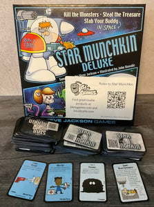 The game Star Munckin with the accessibility kit on it. The door and treasure cards all have both braille and QR codes on them