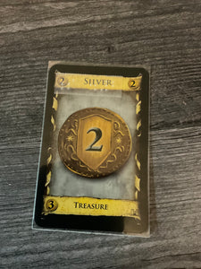 A close up on a sleeved silver card with a transparent braille sticker on it