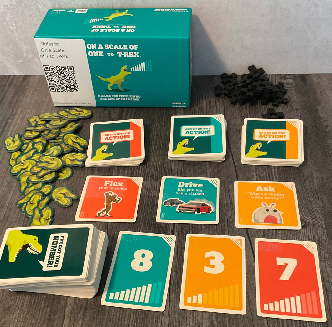 Scale of 1 to T-Rex game laid out. Replacement tokens for the bad tokens are shown and all the different decks are sorted.