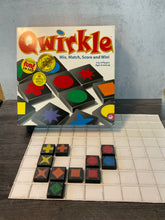 Load image into Gallery viewer, Quirkle box displayed with pieces on the tactile board
