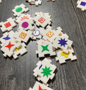 Shot of the colorful acrylic pieces scattered on the table.