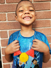 Load image into Gallery viewer, A boy with a big smile wearing the core beads as a necklace
